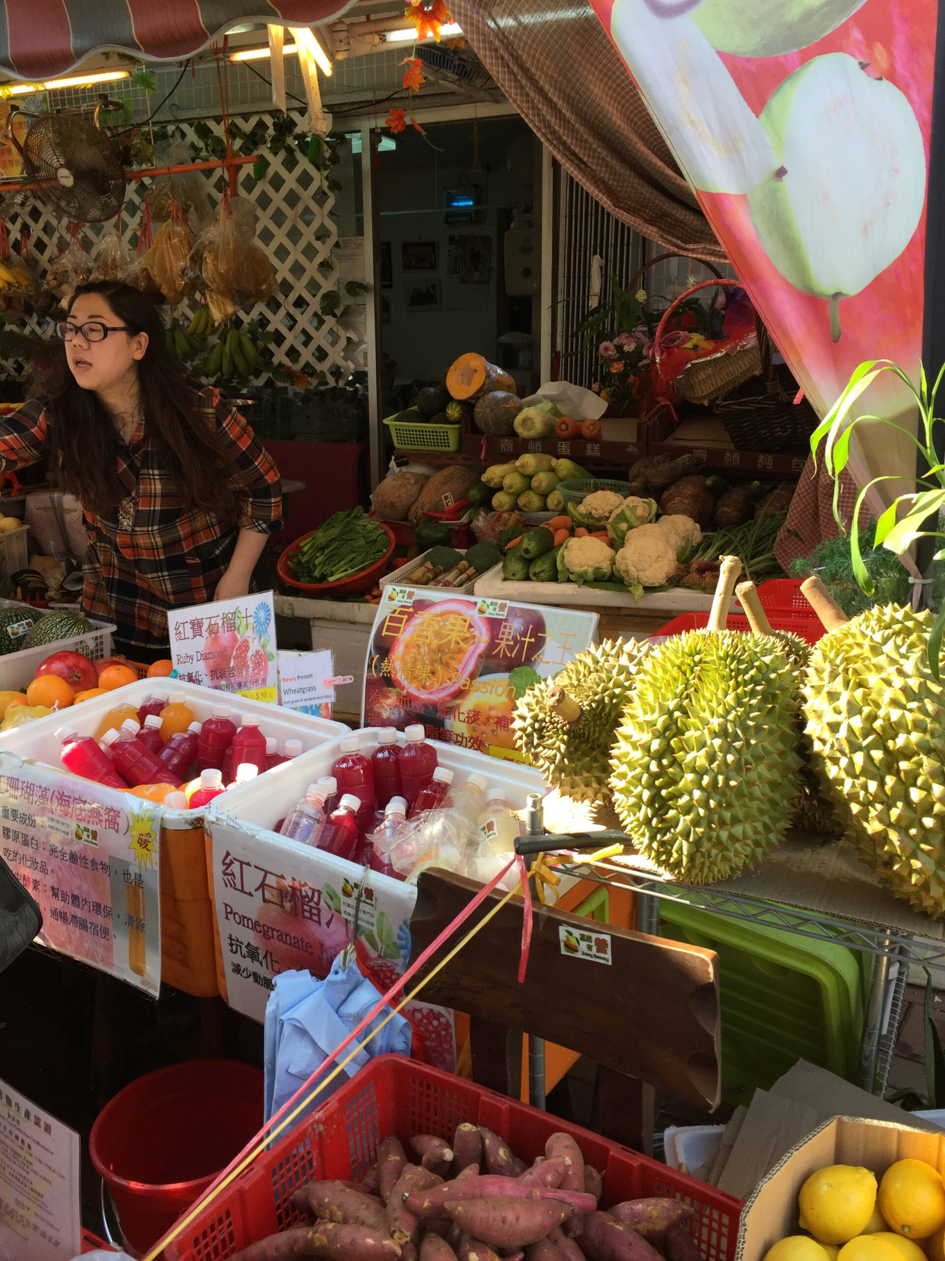 Thailand market girl selling durian and other fruit